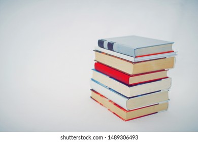 Stack of books on white background
