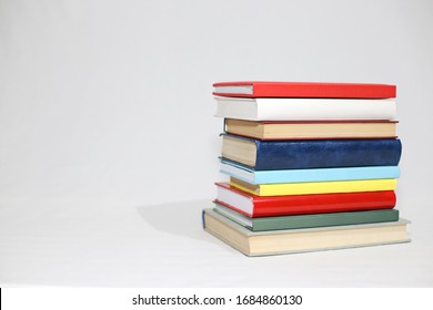 Stack of books on white background - Shutterstock ID 1684860130