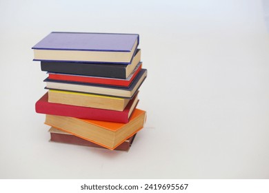 Stack of books on white background