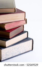 Stack of books on white background.