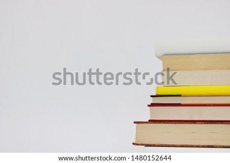 Stack of books on white background