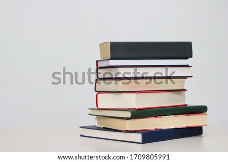 Stack of books on white background