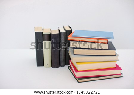Stack of books on white background