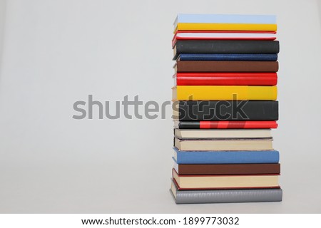 Stack of books on white background