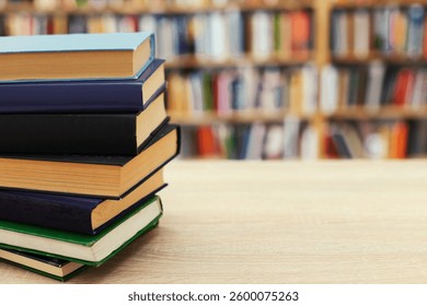 stack of books on white blurred background, education, reading, 
learning, studying, knowledge, literature,education background, Romance novel, crime novel, historical novel, collection of poems