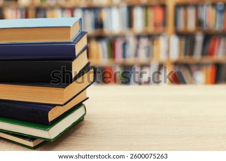stack of books on white blurred background, education, reading, 
learning, studying, knowledge, literature,education background, Romance novel, crime novel, historical novel, collection of poems