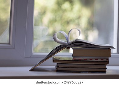 Stack of books on the window Arrangement of books on the windowsill Children's books School curriculum Reading during the summer holidays