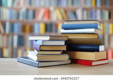 stack of books on wooden table against blurred background. space for text, education, school - Powered by Shutterstock