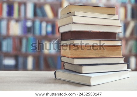 stack of books on wooden table
