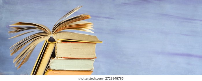 stack of books and an open book, Back to school,education,knowlege is power, panoramic, free copy space