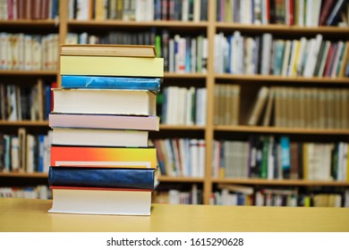 Stack of books in public library - Shutterstock ID 1615290628