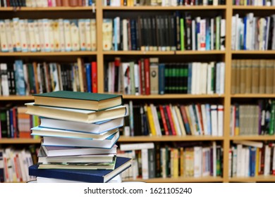 Stack of books in public library - Shutterstock ID 1621105240