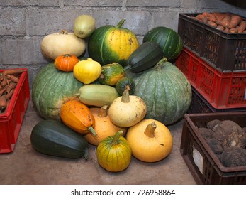 Stack and boxes with vegetables in cellar