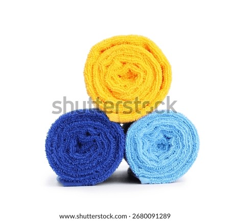Stack of bright terry towels isolated on white