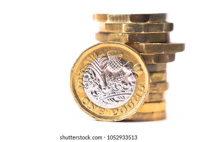 Stack Of British Pound Coins With One Coin Stood Up At Front