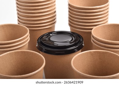 Stack of the brown disposable cups isolated on white background.