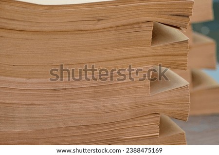 stack of brown envelopes with blur background. neatly arranged in the paper and printing industry