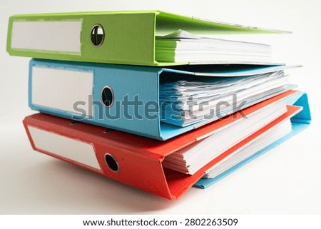 Stack of business finance data finder on white background.