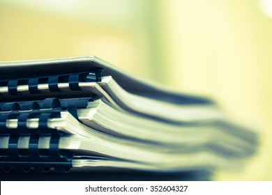 Stack Of Business Papers With Black Clips