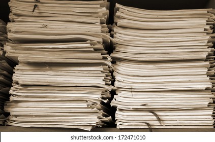 Stack Of Business Papers On The Shelf 