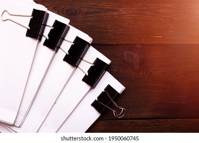 A stack of business papers. Business papers are stapled together.