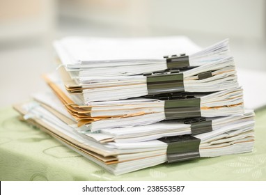 Stack Of Business Report Paper Files With Black Clips 