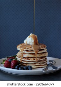 Stack Of Buttermilk Pancakes With A Drizzle Of Caramel Sauce