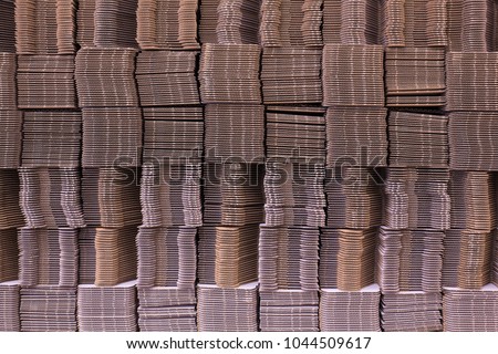 Stack of cardboard boxes. Corrugate cardboard. Corrugated paper single wall. Corrugated fiberboard. Linerboard board. Pleated paper.