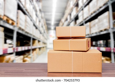 Stack of cardboard boxes on warehouse background