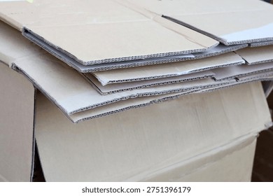 Stack of cardboard boxes and paper prepared for recycling