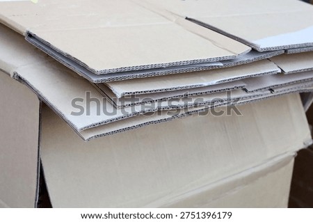 Stack of cardboard boxes and paper prepared for recycling