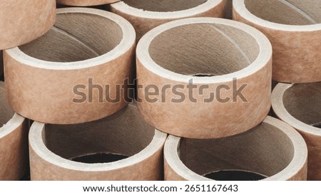 Stack of cardboard packaging tubes, corners brown and arranged in a row as background templates of pages and banners of delivery logistics concept