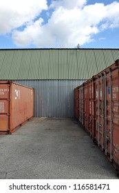 Stack of Cargo Containers at warehouse