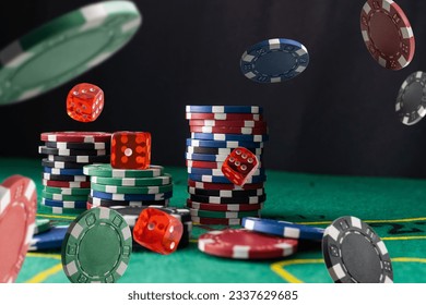 Stack of Casino gambling chips on green table