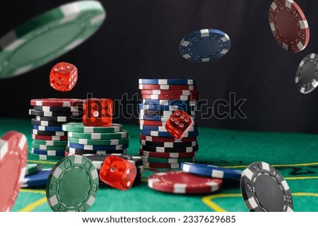 Stack of Casino gambling chips on green table