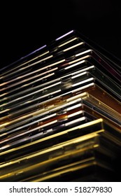 the stack of CD boxes on a dark background
