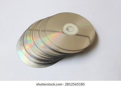 Stack of CD disc isolated in white background, realistic DVD, Blu-ray. Capturing vintage concept.