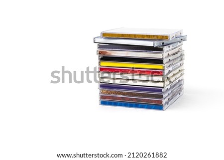Stack of CDs in boxes on a white background.Isolate.