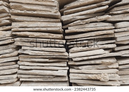 Stack of ceramic tiles. Ex-demolition. Not new. The tile texture is uneven and irregular. Floortile. Ceramics. Selective focus. Pattern.