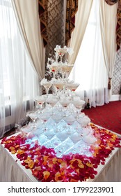 Stack of champagne glasses on table in wedding party