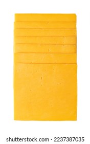 Stack of cheddar cheese slices, sliced natural cheese, sharp-tasting and colored orange with annatto, a natural food coloring. Close-up, from above, isolated on white background, macro food photo.