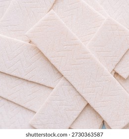 Stack of chewing gum sticks close up, chewing gum texture background