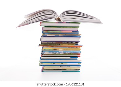 Stack Of Children's Books Isolated On White. Concept Of Learning, Education And Stody.