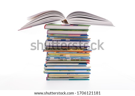 Stack of children's books isolated on white. Concept of learning, education and stody.