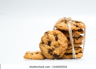 A stack of chocolate chip cookies isolated on a white background