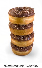 stack of chocolate covered doughnuts