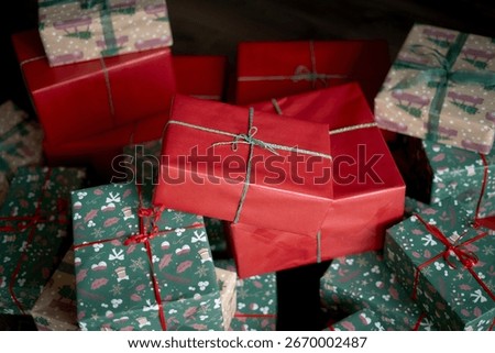 stack of christmas presents on red background