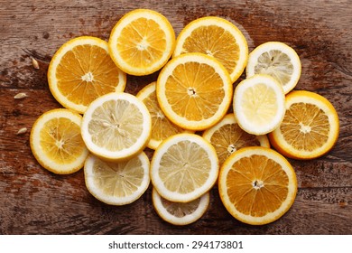 stack of citrus fruits slices. Oranges and lemons. On wooden table - Powered by Shutterstock