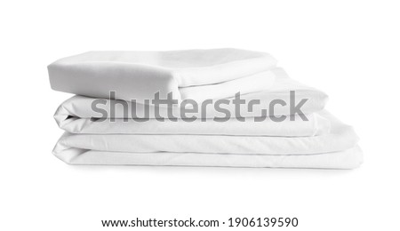 Stack of clean bed linen isolated on white