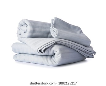 Stack of clean bed sheets on white background - Shutterstock ID 1882125217